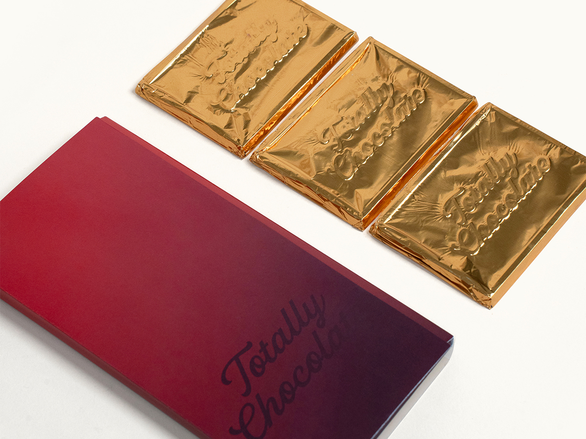 Three engraved chocolate bars with the Storyteller presentation card